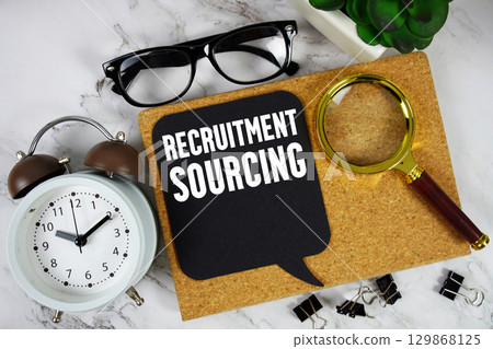 Recruitment Sourcing text with alarm clock and magnifying glass on marble background 129868125