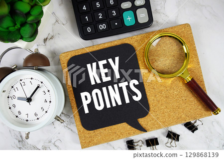 Key Points text with Calculator, alarm clock and magnifying glass on marble background 129868139