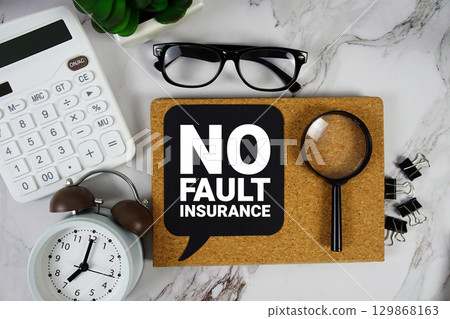 No fault insurance text with Calculator, alarm clock and magnifying glass on marble background No fault insurance text with Calculator, alarm clock and magnifying glass on marble background 129868163