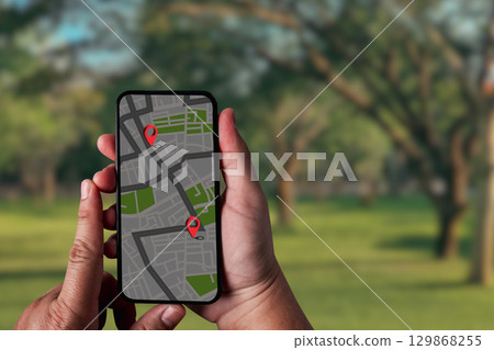 GPS Map to Route Destination A person uses online maps and technology to search, plan journeys, find directions 129868255