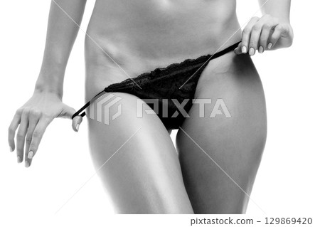 Woman is about to pull off her panties Woman is about to pull off her panties 129869420