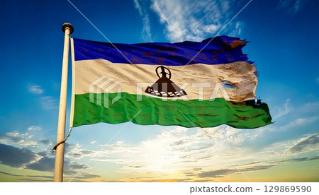 An old, torn and decayed flag of Lesotho. 129869590