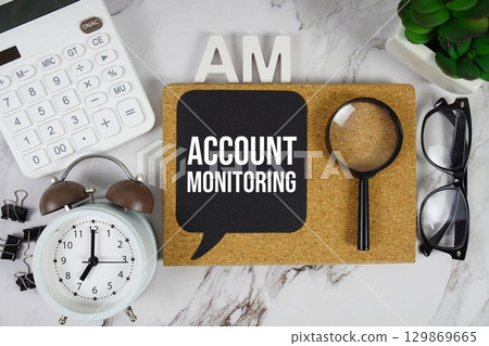 AM Account Monitoring acronym with calculator, alarm clock and magnifying glass, Business concept background 129869665