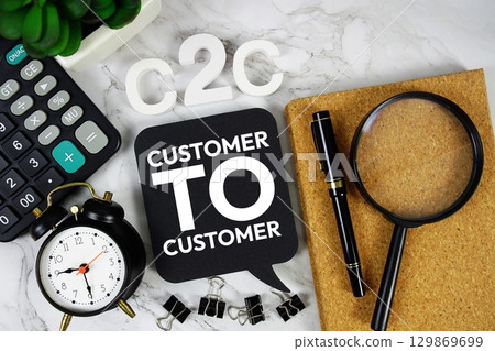 C2C Customer to Customer acronym with calculator, alarm clock and magnifying glass, Business concept background 129869699