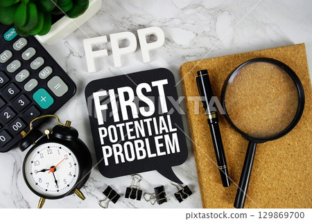 FPP First Potential Problem acronym with calculator, alarm clock and magnifying glass, Business concept background 129869700