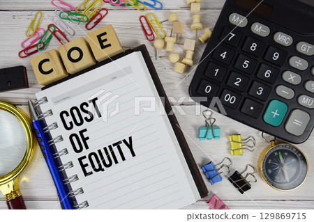 COE Cost of Equity acronym on notepad, Business and Financial concept 129869715