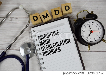 DMDD Disruptive Mood Dysregulation Disorder acronym on notepad, Healthcare and Medical concept background 129869737