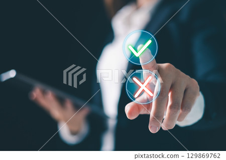 Checkmark and cross icons, symbolizing decision making and approval or rejection actions. digital business interface, technology enables selection and decision making to choose approval and rejection 129869762