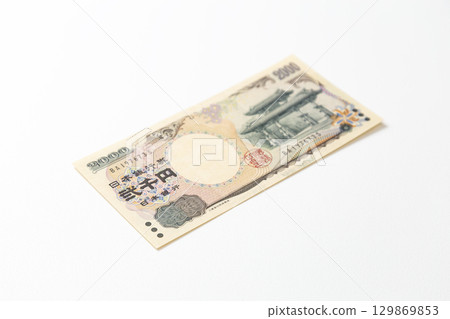 Two thousand yen bill on white background Two thousand yen bill on white background 129869853