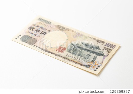 Two thousand yen bill on white background Two thousand yen bill on white background 129869857