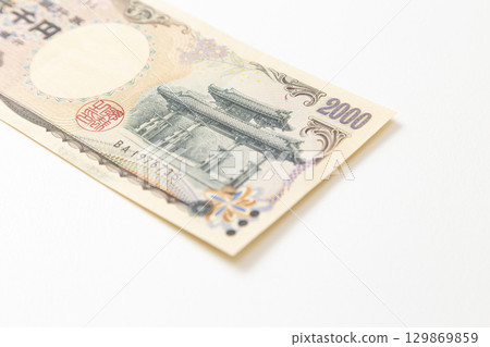 Two thousand yen bill on white background Two thousand yen bill on white background 129869859