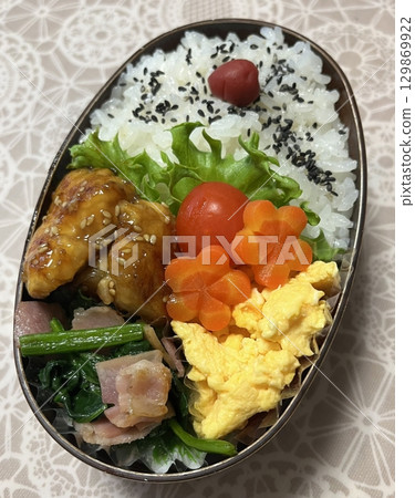 A traditional Korean dosirak, beautifully arranged with rice, assorted banchan, and savory proteins. Balanced and visually inviting, its a portable meal packed with vibrant flavors. A traditional Korean dosirak, beautifully arranged with rice, assorted banchan, and savory proteins. Balanced and visually inviting, its a portable meal packed with vibrant flavors. 129869922