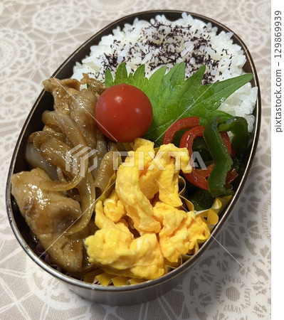 A traditional Korean dosirak, beautifully arranged with rice, assorted banchan, and savory proteins. Balanced and visually inviting, its a portable meal packed with vibrant flavors. A traditional Korean dosirak, beautifully arranged with rice, assorted banchan, and savory proteins. Balanced and visually inviting, its a portable meal packed with vibrant flavors. 129869939