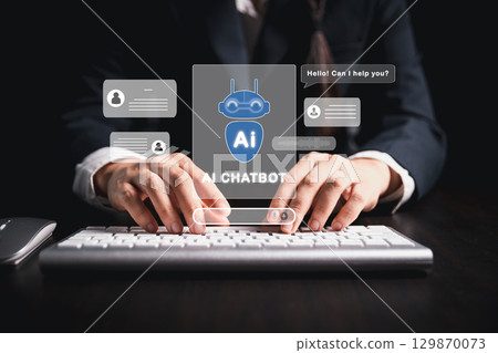 Businesswoman uses chatbot powered by AI technology and artificial intelligence to chat and converse with smart robot system analyzes data to help solve work-related problems. AI chatbot concept. Businesswoman uses chatbot powered by AI technology and artificial intelligence to chat and converse with smart robot system analyzes data to help solve work-related problems. AI chatbot concept. 129870073
