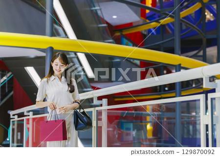 Woman shopping at the mall Woman shopping at the mall 129870092