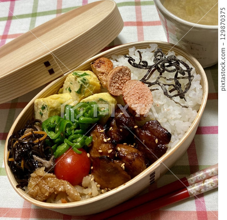 A traditional Korean dosirak, beautifully arranged with rice, assorted banchan, and savory proteins. Balanced and visually inviting, its a portable meal packed with vibrant flavors. A traditional Korean dosirak, beautifully arranged with rice, assorted banchan, and savory proteins. Balanced and visually inviting, its a portable meal packed with vibrant flavors. 129870375