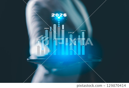 Business growth strategy for 2026. Businesswoman points ahead, symbolizing future success, company development, and business planning, driven by motivation and opportunity for the upcoming year. Business growth strategy for 2026. Businesswoman points ahead, symbolizing future success, company development, and business planning, driven by motivation and opportunity for the upcoming year. 129870414