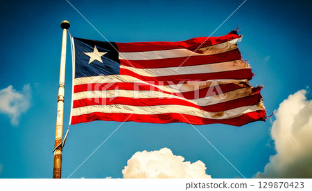An old, torn and decayed Liberian flag. 129870423