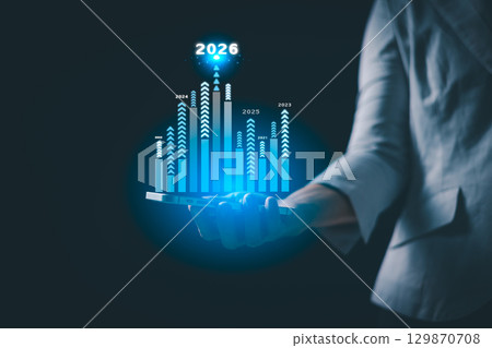 Business growth strategy for 2026. Businesswoman points ahead, symbolizing future success, company development, and business planning, driven by motivation and opportunity for the upcoming year. Business growth strategy for 2026. Businesswoman points ahead, symbolizing future success, company development, and business planning, driven by motivation and opportunity for the upcoming year. 129870708