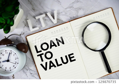 LTV Loan To Value acronym on notepad, Business concept background 129870735
