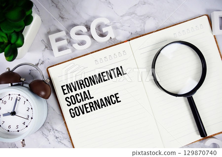 ESG Environmental Social Governance acronym on notepad, Business concept background 129870740
