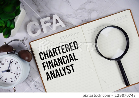 CFA Chartered Financial Analyst acronym on notepad, Business concept background 129870742