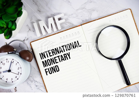 IMF International Monetary Fund acronym on notepad, Business concept background 129870761