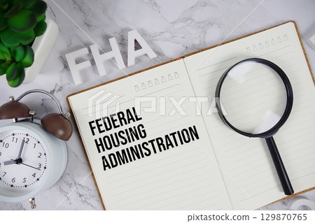 FHA Federal Housing Administration acronym on notepad, Business concept background FHA Federal Housing Administration acronym on notepad, Business concept background 129870765