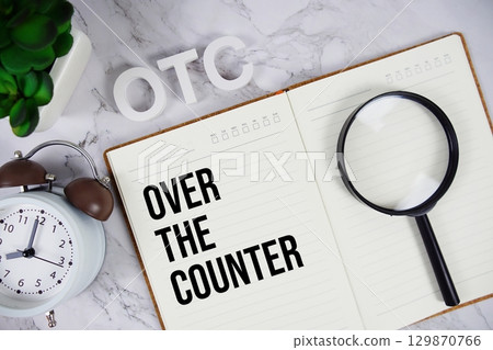 OTC Over The Counter acronym on notepad, Business concept background OTC Over The Counter acronym on notepad, Business concept background 129870766