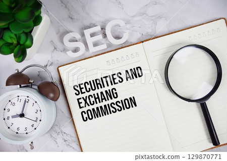 SEC Securities And Exchange Commission acronym on notepad, Business concept background 129870771