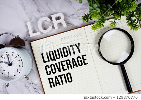LCR Liquidity Coverage Ratio acronym on notepad, Business concept background LCR Liquidity Coverage Ratio acronym on notepad, Business concept background 129870776