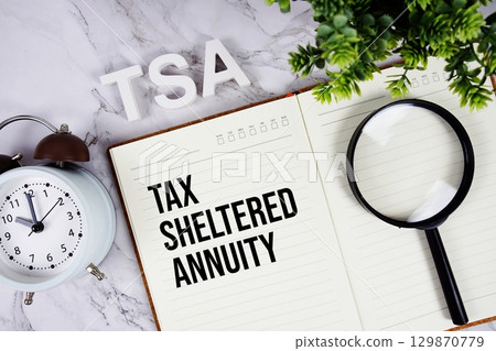 TSA Tax-Sheltered Annuity acronym on notepad, Business concept background 129870779