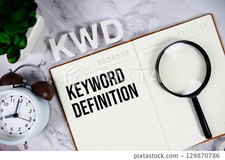 KWD Kuwaiti Dinar acronym on notepad, Financial concept background KWD Kuwaiti Dinar acronym on notepad, Financial concept background 129870786