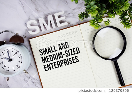 SME Small And Medium-sized Enterprises acronym on notepad, Business concept background SME Small And Medium-sized Enterprises acronym on notepad, Business concept background 129870806