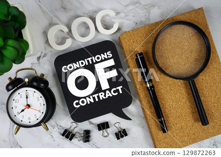 COC Conditions of Contract text with alarm clock and magnifying glass on marble background COC Conditions of Contract text with alarm clock and magnifying glass on marble background 129872263