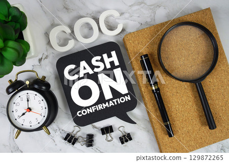 COC Cash On Confirmation text with alarm clock and magnifying glass on marble background 129872265
