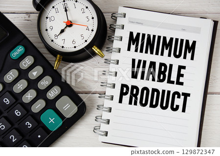 Minimum Viable Product text with calculator and alarm clock on wooden background Minimum Viable Product text with calculator and alarm clock on wooden background 129872347