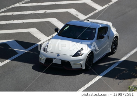 Sports car image running on the highway 129872591