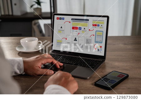 UX UI design process concept showing a designer UX UI design process concept showing a designer 129873080