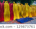 Dyed multicolored reeds are dried at the factory for production of traditional Vietnamese mats in Vietnam 129873761