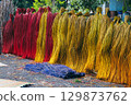 Dyed multicolored reeds are dried at village handicraft factory for production of traditional Vietnamese mats in Vietnam 129873762