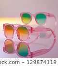 Colorful sunglasses. color glasses on pink surface over pink background 129874119