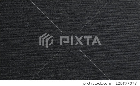 Black rough paper texture, close view paper pattern background 129877078