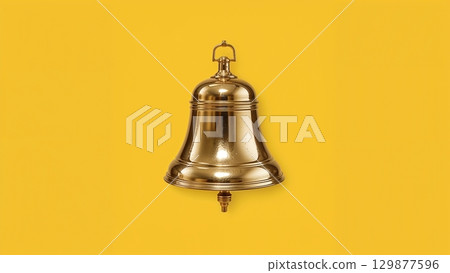 Metal bell over yellow background 129877596