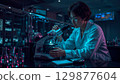 Biochemical lab technician analyzing samples in a modern lab background 129877604