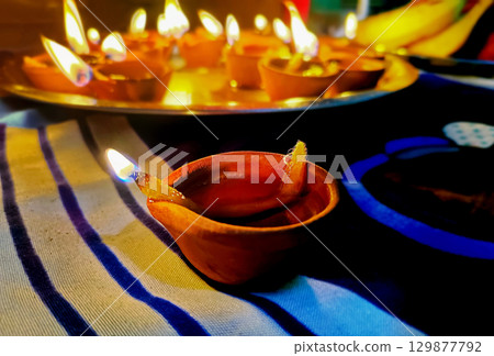 Traditional Clay Oil Lamps Lit on Festival Night Traditional Clay Oil Lamps Lit on Festival Night 129877792