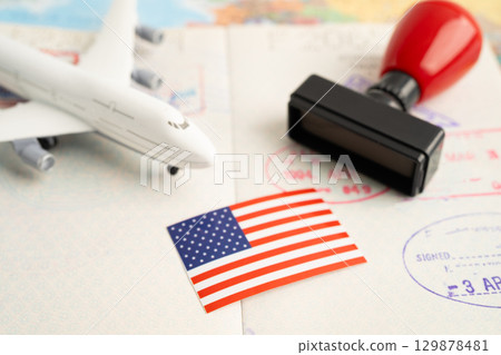 USA passport with approved stamp on document for tourism to immigration at airport in country. 129878481