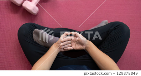 Mindful Relaxation. Close-up of a man hands in a meditative pose, promoting mindfulness and relaxation. 129878849