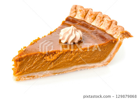 Traditional American pumpkin pie with whipped cream on a white background. Top view. Thanksgiving Day. 129879868