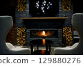 Cozy living room with a modern stone fireplace, warm flames flickering inside, creating an inviting and tranquil atmosphere. 129880276